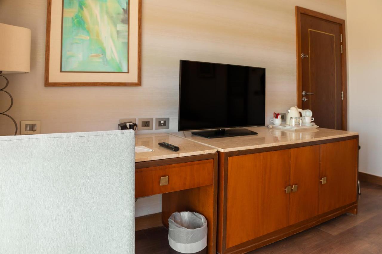 Sharm Dreams Vacation Club - Aqua Park Otel Dış mekan fotoğraf A television in a hotel room